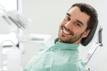 a male patient getting ready for tooth-colored fillings in Apex, NC