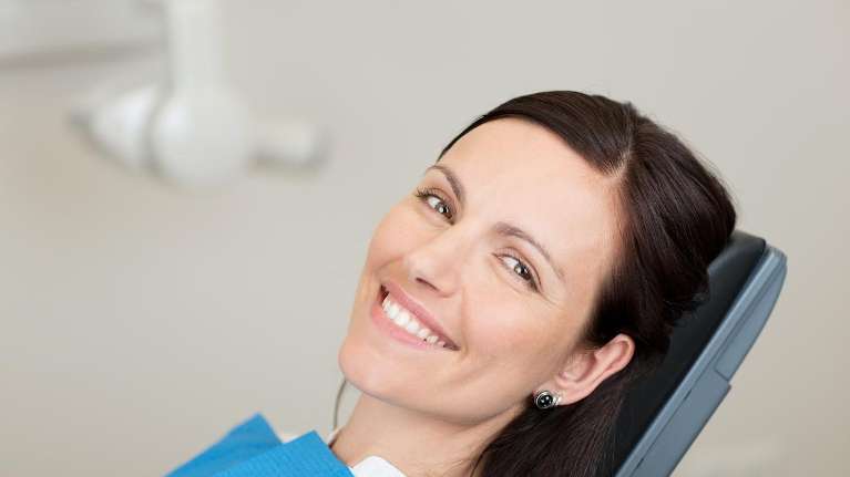 A patient after Oral Exams and Dental Cleanings in Apex, NC