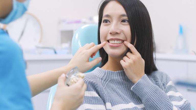 A patient after getting ready for a dental cleaning in Apex, NC