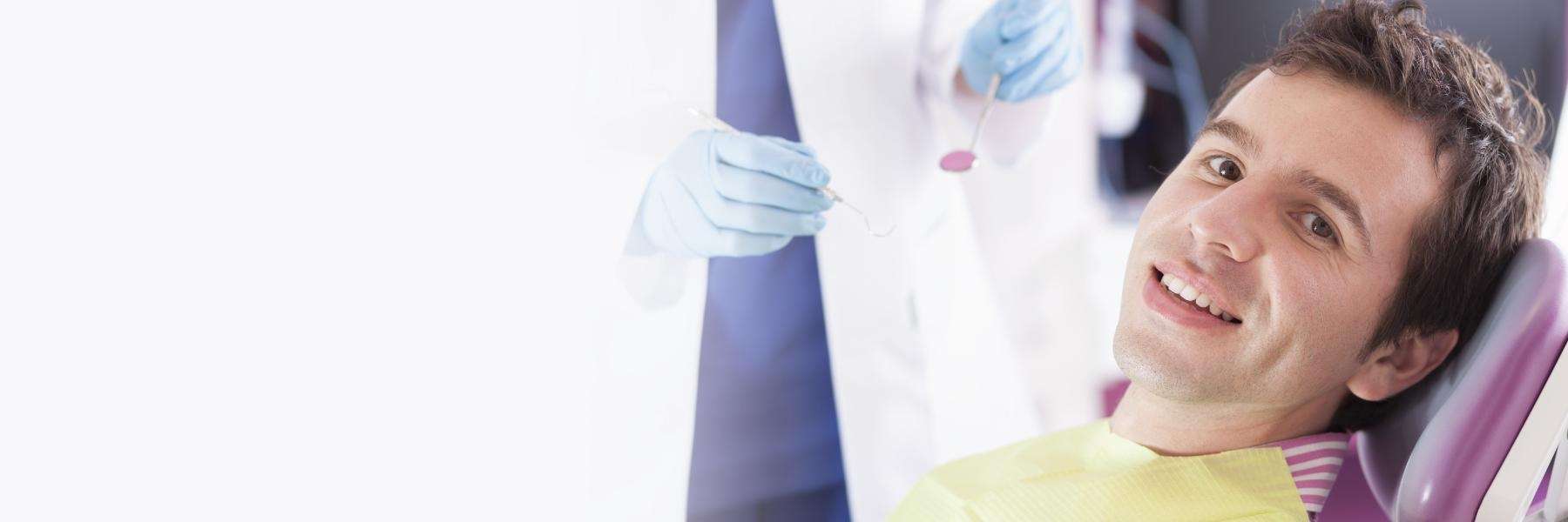 man after dental cleaning in Apex, NC