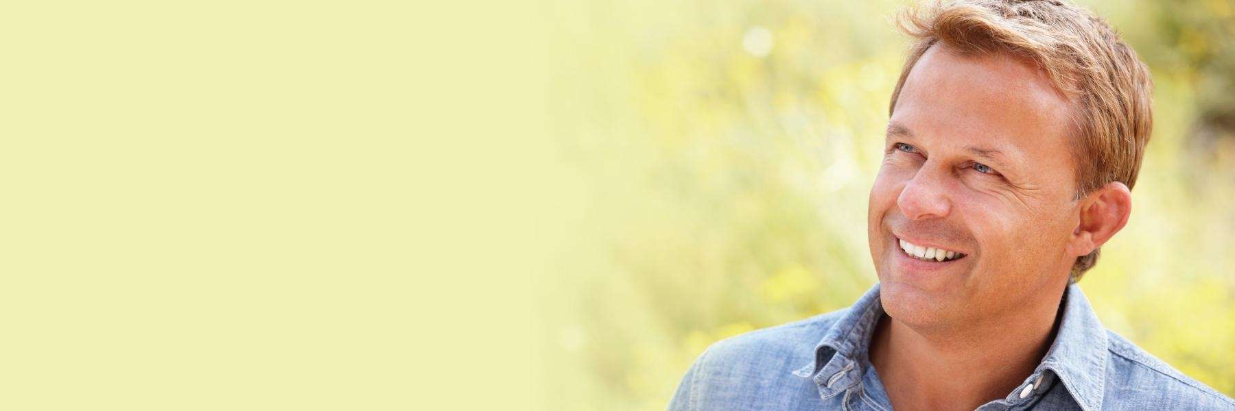 man smiling with dental implants Apex, NC