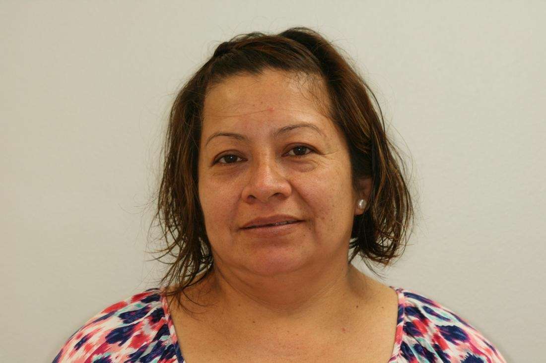 female patient hiding smile before dental work