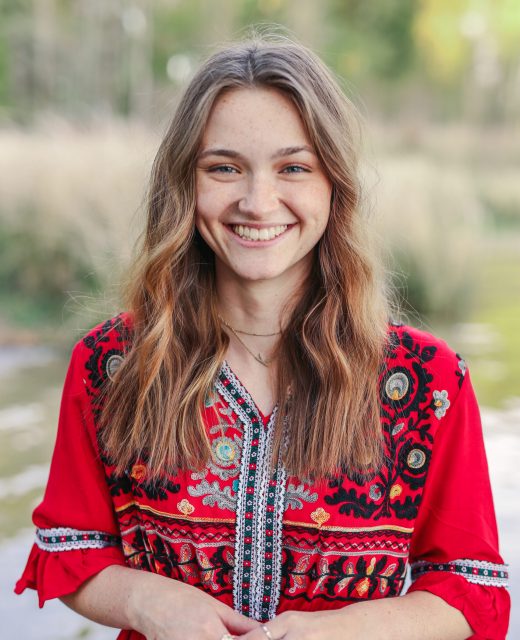 Young woman smiling outdoors