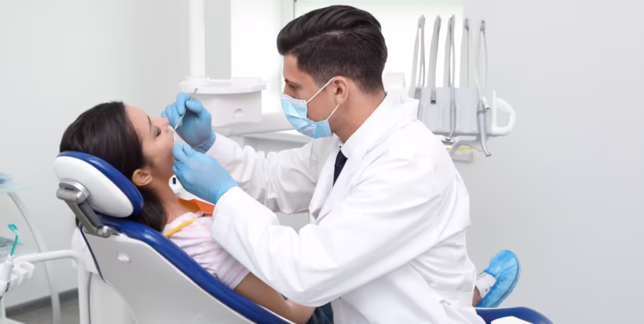 Dentist examining a patient before a tooth extraction