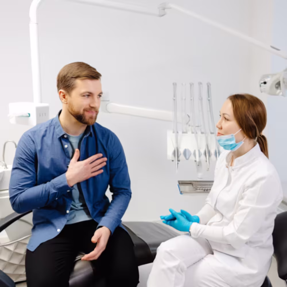 Dental provider speaking with a patient about treatment concerns