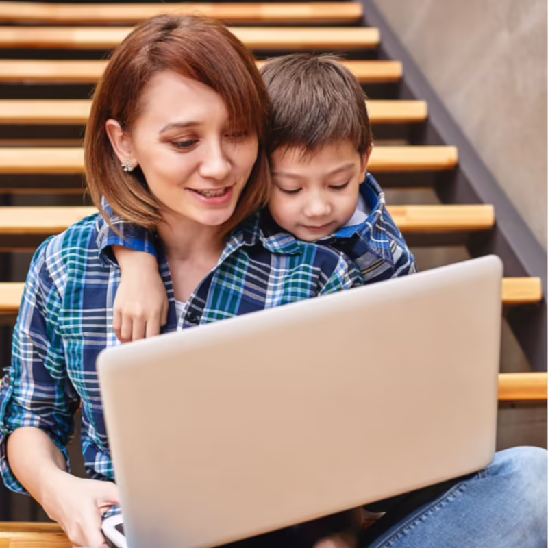 Woman and child using a laptop together